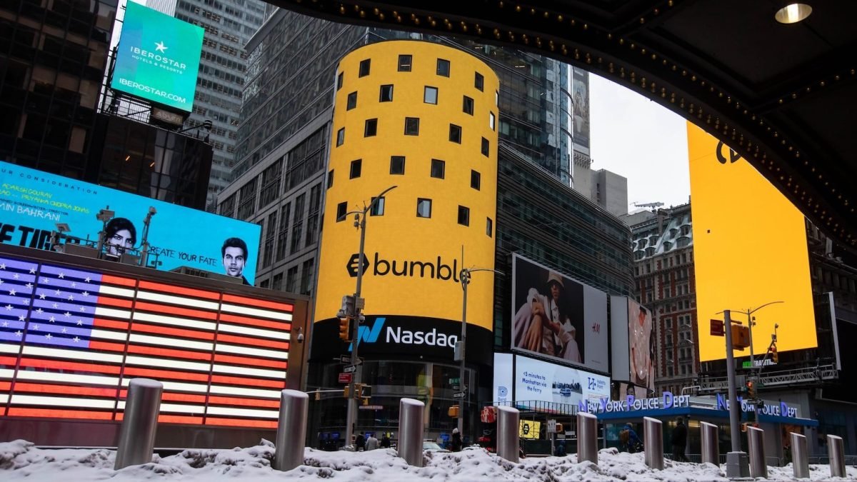 Monitors display Bumble Inc. signage during the company's initial public offering (IPO) in front of the Nasdaq MarketSite in New York, U.S., on Thursday, Feb. 11, 2021.