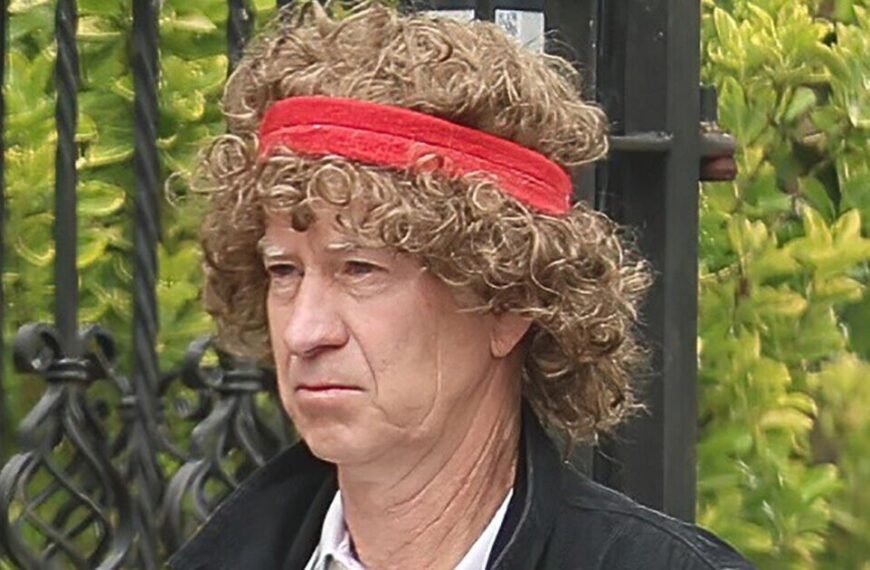 Tennis legend John McEnroe looks unrecognisable as he dons huge curly wig | Celebrity News | Showbiz & TV