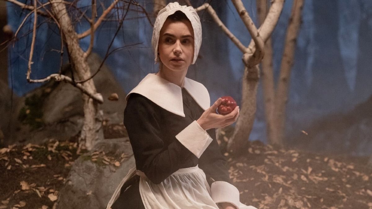Lily Collins holding apple in nun outfit in Maxxxine