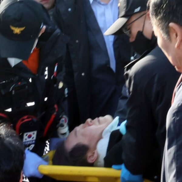 Lee was taken away on a stretcher. Pic: AP